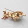 Brooch "Hedgehog with Flower", colored in gold