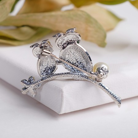 Brooch "Owls" on a flower branch, white-green color in silver-1