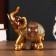 Polystone souvenir "African elephant in the gold, openwork blanket" MIX 12x11x4.7 cm
