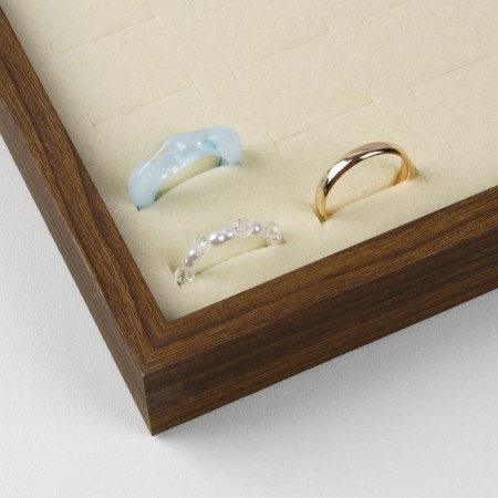 The stand for the Eco Rings is 100 seats, 35.1 × 24.1 × 2.7 cm, beige color in a tree-1