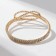 Bracelet with rhinestones "ice" waves, white color in gold