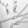 Set 4 objects: earrings, necklaces, bracelet, ring "pattern" thin, white color in silver