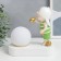 Souvenir Polystone Light "Baby in a white cap, with a gold bubble at the ball" 16.5x8x16 cm