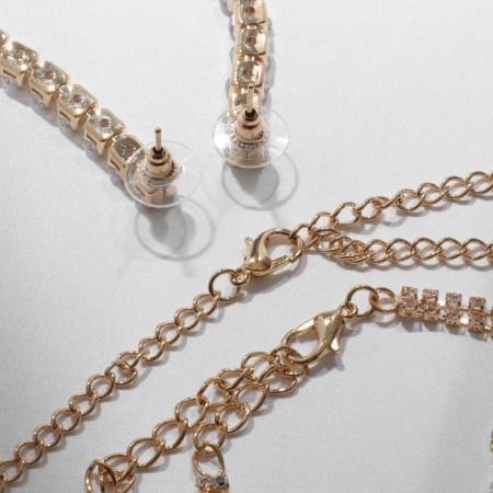 Set 4 objects: earrings, necklaces, bracelet, ovala ovals ring, white color in gold-1