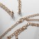 Set 4 objects: earrings, necklaces, bracelet, ovala ovals ring, white color in gold