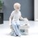 Souvenir Ceramics "Boy on a bench with a dog" 14 cm