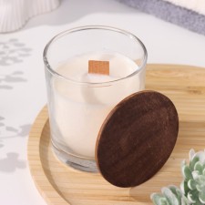 A candle made of soy wax in a glass with a wooden wick and a “delicate cashmere” lid, 110 gr