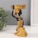 Souvenir Polystone Summary "African Rudo with a large basin on the head" D = 8 cm 9.5x9.5x18 cm 106