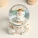 Souvenir Polystone Water Ball "Santa Claus with a gift" White with gold 7x8x9 cm