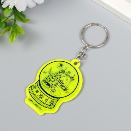 A keychain plastic reflective "snowball with a Christmas tree by the fireplace" 5.5x3.8 cm-1