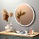Wall mirror in a round case made of metal, d = 60, white ruby