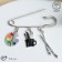 Pin "Artist" with pendants, 7 cm, color in silver