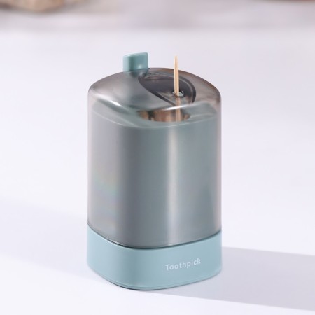 The dispenser for toothpicks is automatic, the color is green-2