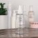 A bottle for storage, with a spray, with a division scale, 100 ml, white/transparent color