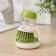 Brush with a dispenser for detergent and stand, green color
