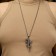 Pendant "Cross" with a snake, color black silver, l = 70 cm