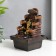 The desktop fountain from the Ganesh network at the cliff with a waterfall 18x12x12 cm
