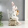 Souvenir Polystone "Hare in a chair with a book and a cup" 26x12x13.5 cm