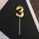 Candle for the cake, the number "3", gold.