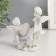 Polystone souvenir "Angels in pink wreaths swing on a rocking chair" 10x11x4.5 cm