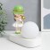 Souvenir Polystone Light "Baby in a green hat, with a gold bubble at the ball" 16.5x8x16 cm