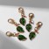 Charm "leaf", green color in gold