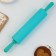 The rolling pin is "tastier at home", 31 x 4.2 cm, silicone, plastic, turquoise color