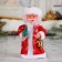 Santa Claus "Long fur coat, with a Christmas tree" 17 cm