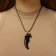 Unisex pendant "Dragon Fang", black color on a black lace, 45 cm