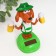 Plastic pendulum from the solar battery "dog with beer circles" 10.5x9.3x6 cm mix