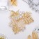 Brooch "Fern", white color in gold
