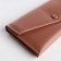Women's wallet on the button, pink color