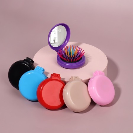 The comb is massage, folding, with a mirror, d = 6 cm, color mix-4
