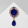 Obval brooch with a drop, the color is blue in gold