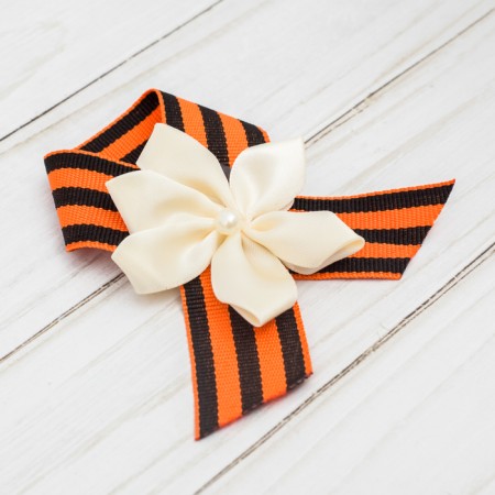 Icon with tape and white flower on Victory Day "May 9"-2