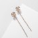 Hanging earrings with rhinestones "Four Liber", white color in gold