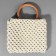 Handles for the bag are wooden, woven, d = 10.2 / 12.5 cm, 2 pcs, the color is light brown