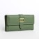Women's wallet on the button, green color