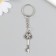 Metal keychain "Key with rhinestones" silver 1.5x1.6x4.2 cm