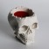 Figure candle in concrete "Crying skull", red