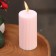 Candle-cylinder with faces, 5x10 cm, light pink, 6 hours