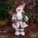 Santa Claus "In a suit with ornaments, skiing and twigs" 31 cm, red-white