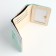 Women's wallet on the button, green color