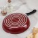 The “Expert” pan, D = 24 cm, glass cover, plastic handle, anti -stick coating, burgundy color