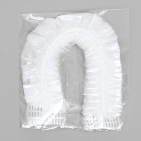 A single shower cap, in individual packaging