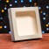 Self -charged box, with a window, silver, 16 x 16 x 3 cm