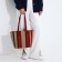 Lightning-there is a beige/brown/red bag.