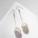 Hanging earrings “wandered ball”, white color in gold, 6.5 cm
