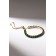 Bracelet with rhinestones "shine" on a puff, emerald color in gold