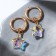 Earrings with the removable element "Transformer" Krystallik Asterisk, Rainbow color in gold